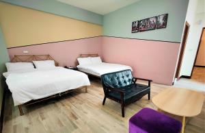 Ένα ή περισσότερα κρεβάτια σε δωμάτιο στο Sofa Potato Homestay