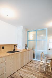 a kitchen with a sink and a table at Xolo in Mexico City