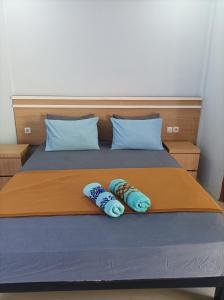 Ένα ή περισσότερα κρεβάτια σε δωμάτιο στο Merendeng Hostel Kuta