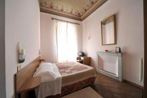 Postel nebo postele na pokoji v ubytování Hotel Iris