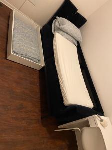 a bunk bed in a room with a bed in it at Triple Room with En Suite Bathroom 0361 in Toronto