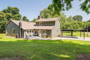 an old house with a porch and a yard at Jefferson City Getaway - 3 Mi to Cherokee Lake! in Jefferson City