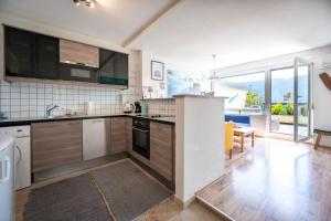 Η κουζίνα ή μικρή κουζίνα στο MOOKI Lake Apartment Ossiacher See&Gerlitzen