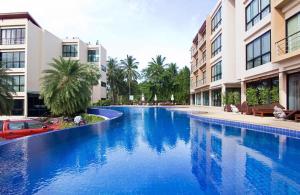 a large swimming pool in the middle of a building at Condo Avanta Unit A306 in Koh Samui 