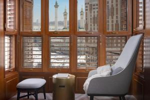 a room with a view of a city from a window at Jumeirah Jabal Omar Makkah in Mecca