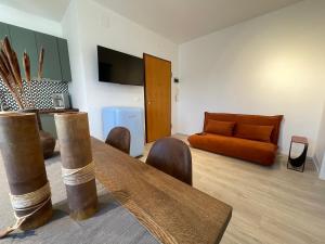 a living room with a couch and a table at A casa di Ada [127] in Pescara