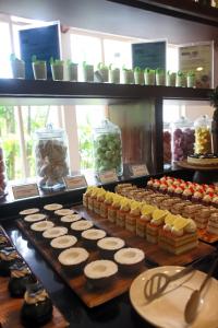 a display of food in jars on a table at Le Meridien Kochi in Cochin