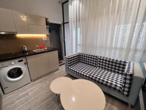 a living room with a couch and a table at Kata Home in Danang +7 photos