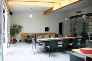 a dining room with a large table and chairs at Hotel Zwettlerhof in Zwettl an der Rodl