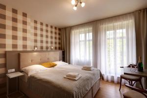 Krevet ili kreveti u jedinici u okviru objekta APARTMÁNY ADAM