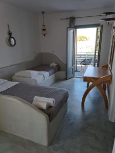 Posteľ alebo postele v izbe v ubytovaní Naxos Summerland resort