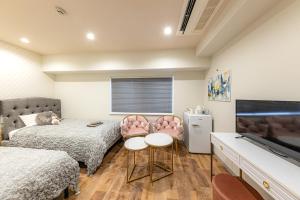 TV a/nebo společenská místnost v ubytování Inn The Omotesando
