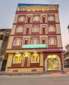a building with a sign on the front of it at Jasoda Heritage By Keshav Global Hotels in Jaipur