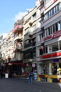 a group of buildings on a city street at Architect's Art House right on Taksim Square in Istanbul