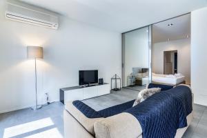 A bed or beds in a room at San Maurilio Apartment