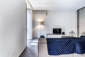 A television and/or entertainment centre at San Maurilio Apartment