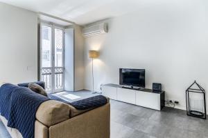 A television and/or entertainment centre at San Maurilio Apartment