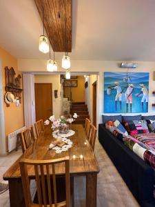 a living room with a table and a couch at Sotira Agia Napa Luxury House in Ayia Napa