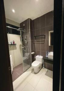 a bathroom with a shower and a toilet and a sink at D Secret Homestay 2BR Condo Luxury in Johor Bahru