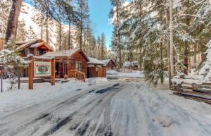 a cabin in the woods in the snow at Metolius Cabin 1 in Camp Sherman