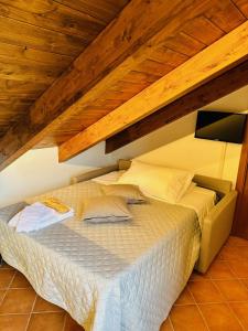 Letto o letti in una camera di Casa Mercurio