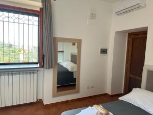 Letto o letti in una camera di Casa Mercurio