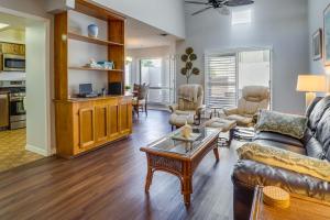 a living room with a couch and a table at Walk to Restaurants Downtown Leesburg Townhome! in Leesburg