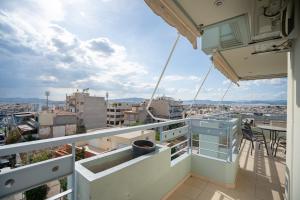 a balcony with a view of a city at Sygrou - fix 2 bedrooms 5 persons apartment by MPS in Athens