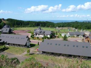 an aerial view of a small town with houses at Awone Shirakami Juniko in Fukaura