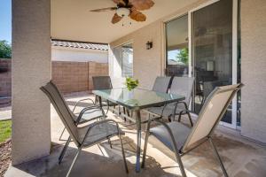 a glass table and chairs on a patio at Phoenix Home with Private Pool, 16 Mi to Downtown! in Phoenix
