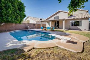 a swimming pool in the backyard of a house at Phoenix Home with Private Pool, 16 Mi to Downtown! in Phoenix