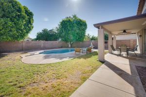 a backyard with a swimming pool and a patio at Phoenix Home with Private Pool, 16 Mi to Downtown! in Phoenix