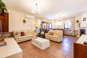 A seating area at ZER- Spacious House with Terrace and Views