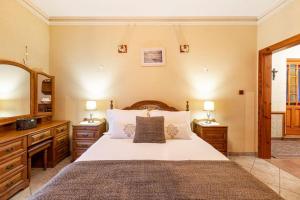 A bed or beds in a room at ZER- Spacious House with Terrace and Views