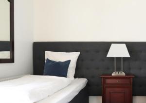 Een bed of bedden in een kamer bij Helnan Phønix Hotel