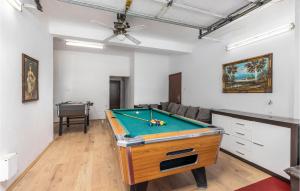 a living room with a pool table in it at Beautiful Home In Spincici With Kitchen in Kastav