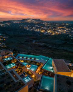 an aerial view of a building at night at North Santorini - A Luxury Spa Hotel in Pyrgos