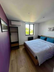 Postel nebo postele na pokoji v ubytování Loft vu sur Pommard