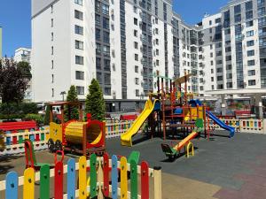 a playground in a city with a colorful play equipment at Apartament lux in Chişinău