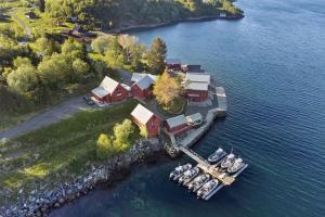 an aerial view of a house on an island in the water at Vesterålen Apartment in Bø i Vesterålen