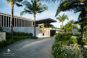 a renderización de un edificio con palmeras en Sailing Club Signature Resort Phu Quoc, en Phu Quoc