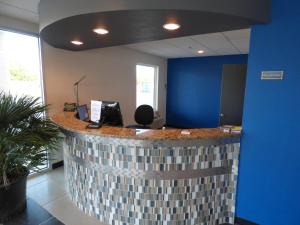 an office with a counter with a blue wall at Republic Hotel in Big Lake