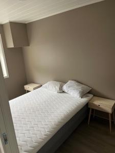 Säng eller sängar i ett rum på Exclusive Apartment
