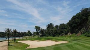 a view of a golf course with a sand bunker at The Empire Brunei in Bandar Seri Begawan