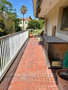 a balcony with a brick floor and a fence at Lovely 4-person apartment 200 m from beaches Cap d'Antibes in Juan-les-Pins