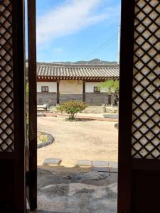 a view of a building from an open door at Yasun Gallery in Gyeongju