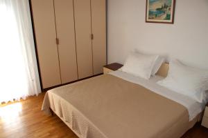 Postel nebo postele na pokoji v ubytování Apartments Granić