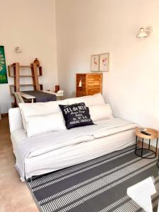 a white couch sitting in a living room at Chalet Tango in Cala en Bosc