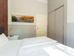 Ein Bett oder Betten in einem Zimmer der Unterkunft Villa Amelia, App. 07