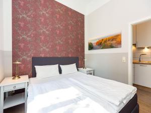 Ein Bett oder Betten in einem Zimmer der Unterkunft Villa Amelia, App. 07